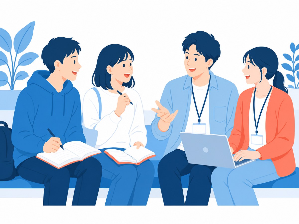 並んで話す学生とスタートアップの社員